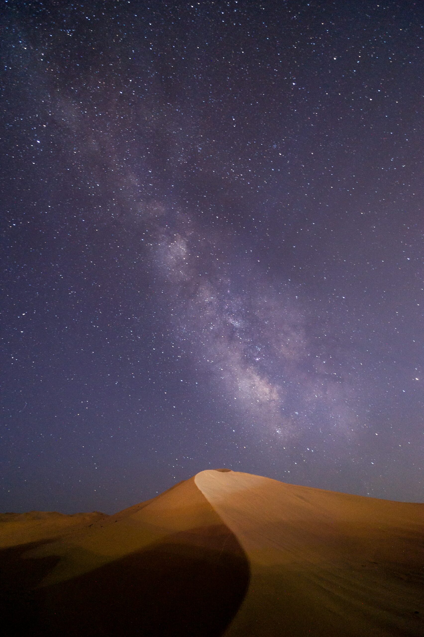 The Milky Way stretching across the night sky above the desert