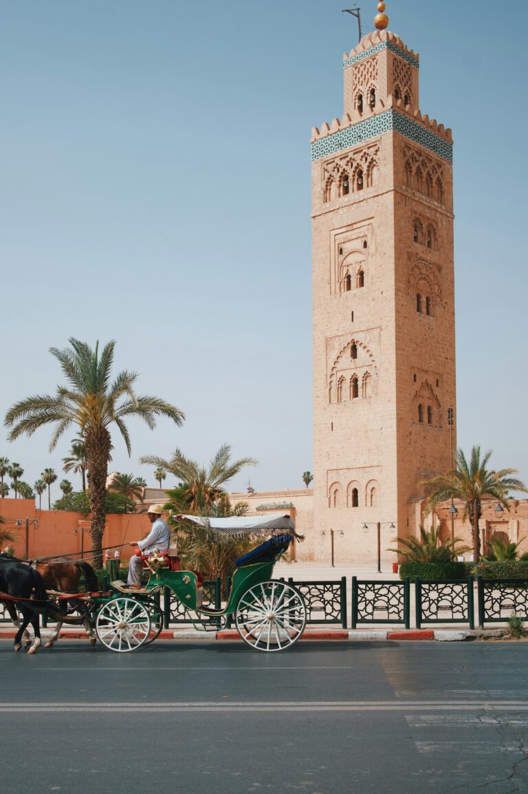 Horse-drawn carriage passing the Koutoubia Mosque in Marrakech