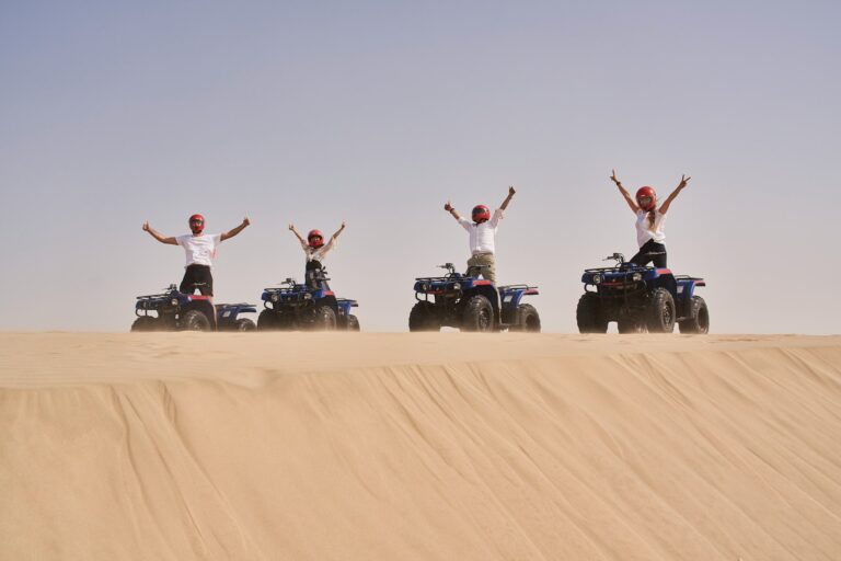Group of riders on quad bikes in the desert